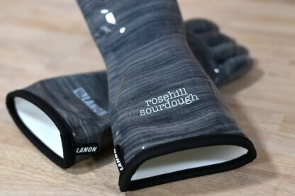 Two oven gloves showing the branding "rosehill sourdough" and "Lanon"